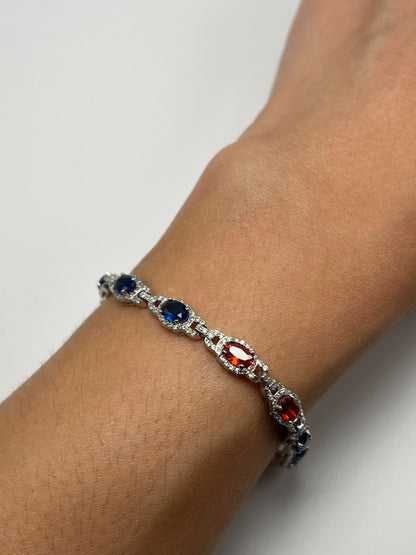 Sterling silver tennis bracelet with blue and red crystals