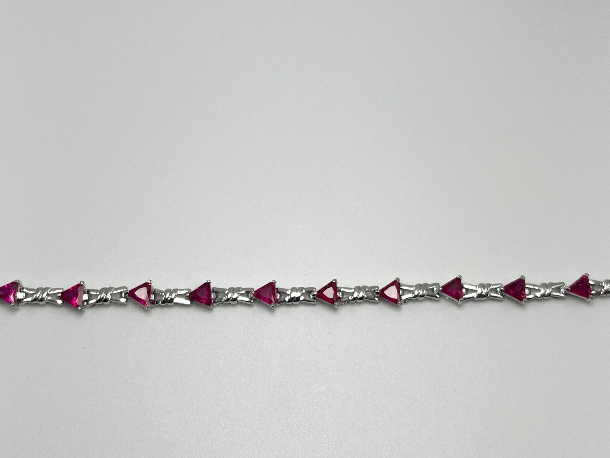 Sterling silver tennis bracelet with pink crystals