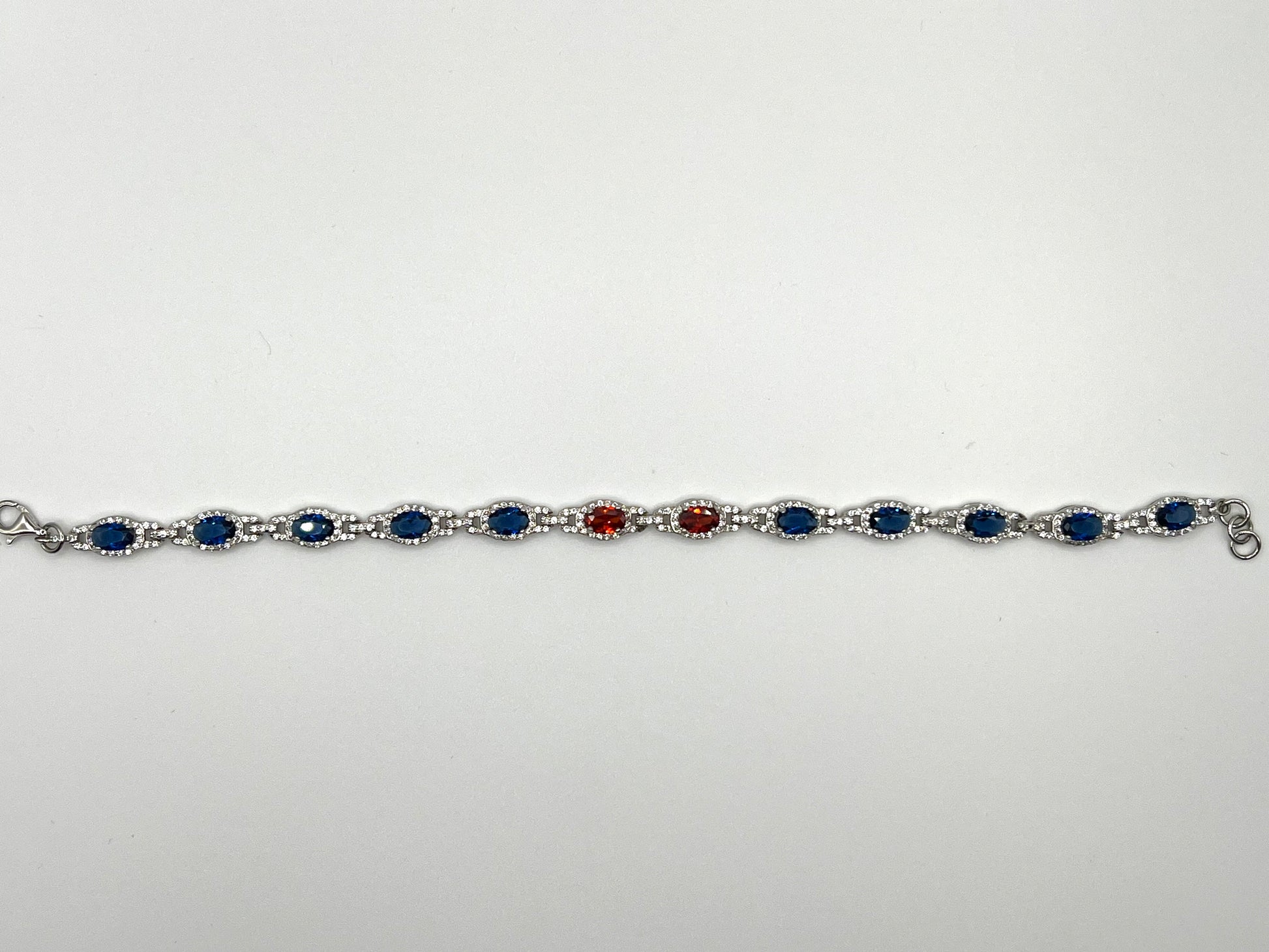 Sterling silver tennis bracelet with blue and red crystals