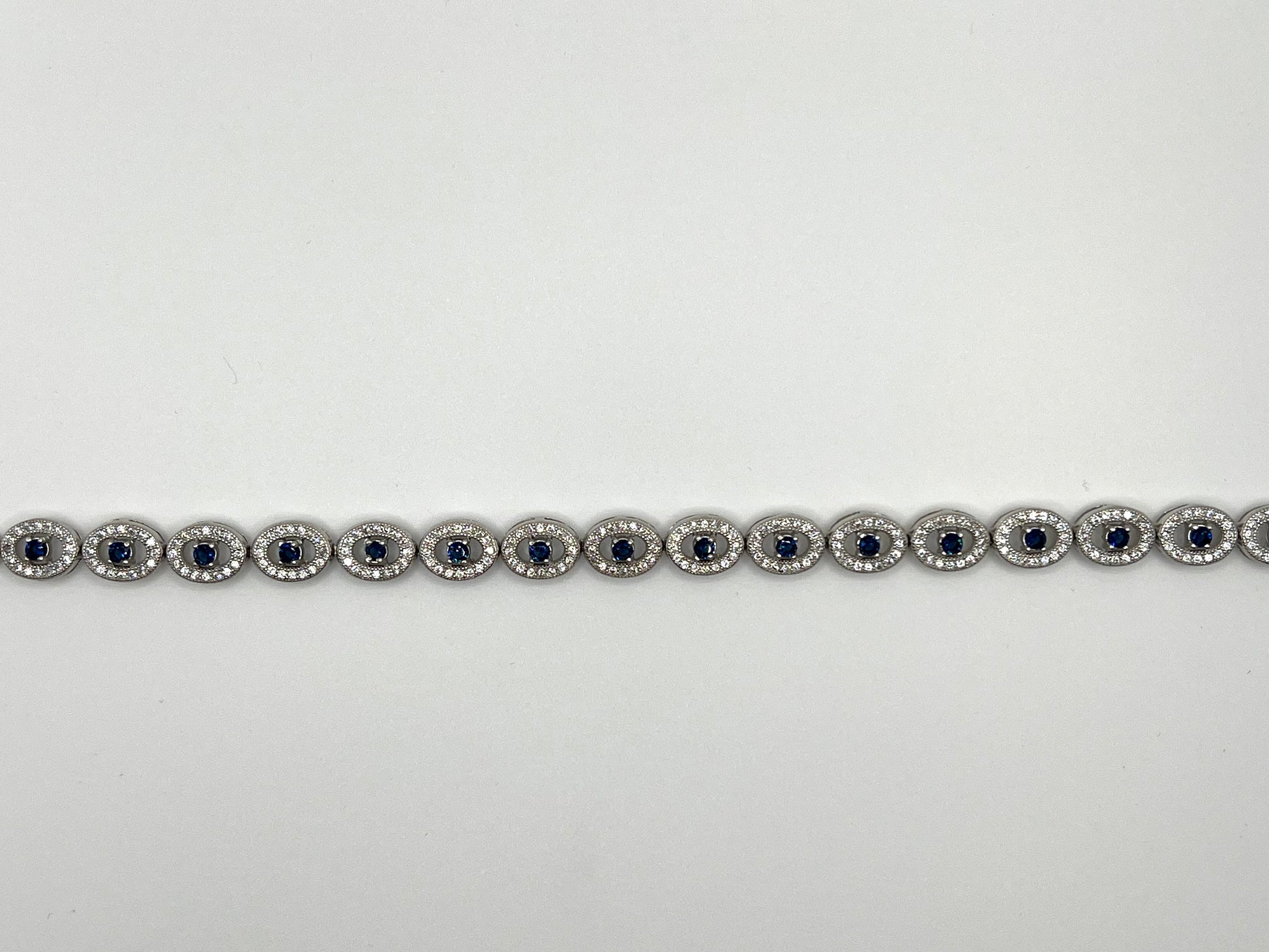 Sterling silver tennis bracelet with white and blue crystals