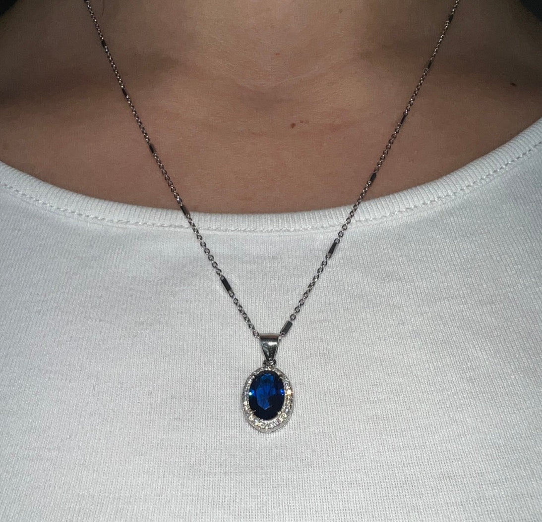 Sterling silver necklace with blue crystal pendant