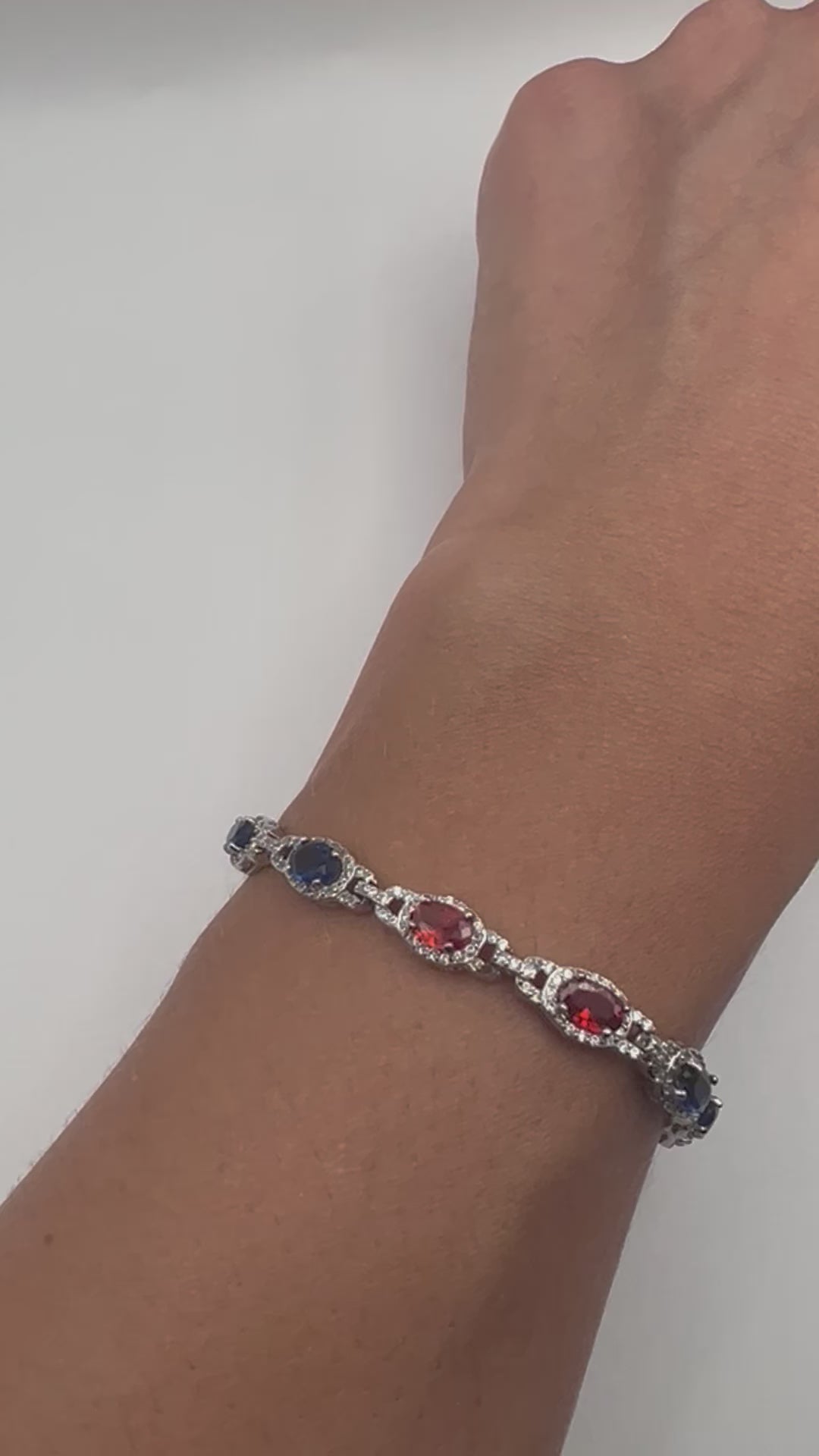 Sterling silver tennis bracelet with blue and red crystals