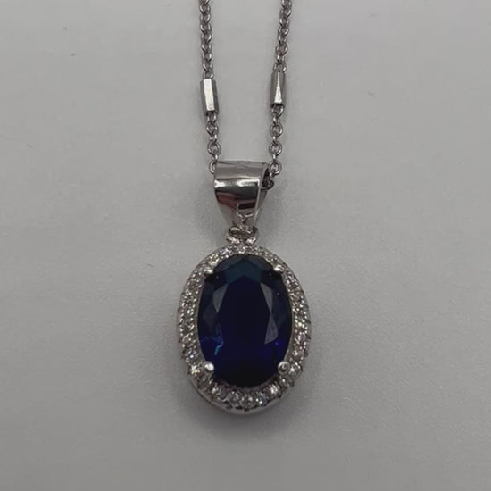 Sterling silver necklace with blue crystal pendant