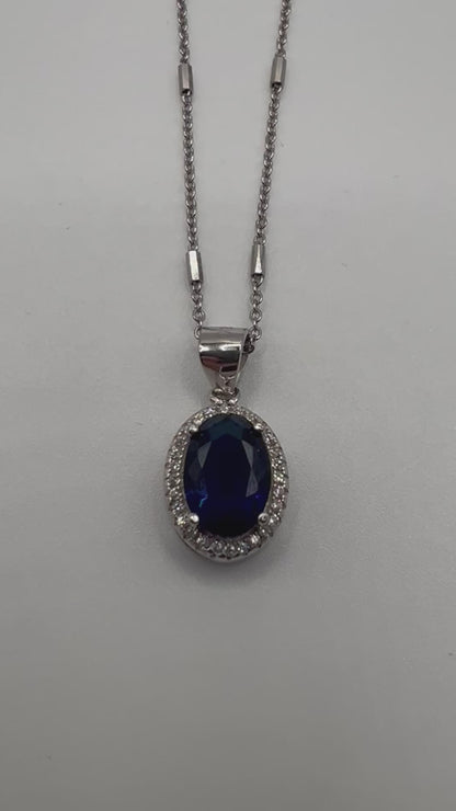 Sterling silver necklace with blue crystal pendant